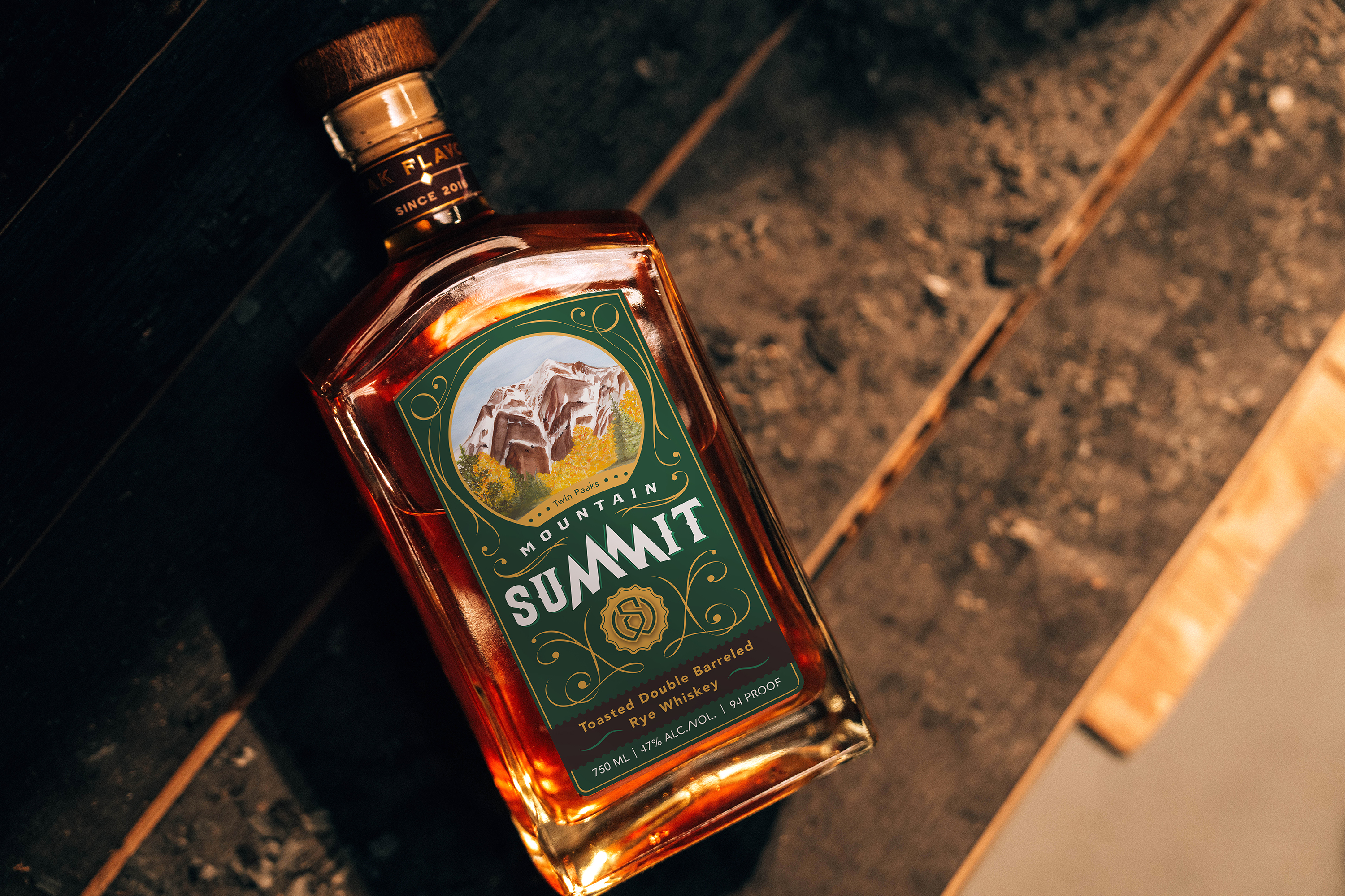 Mountain Summit: Toasted Rye Whiskey Bottle - Professionally photographed. Sitting atop an aging barrel.